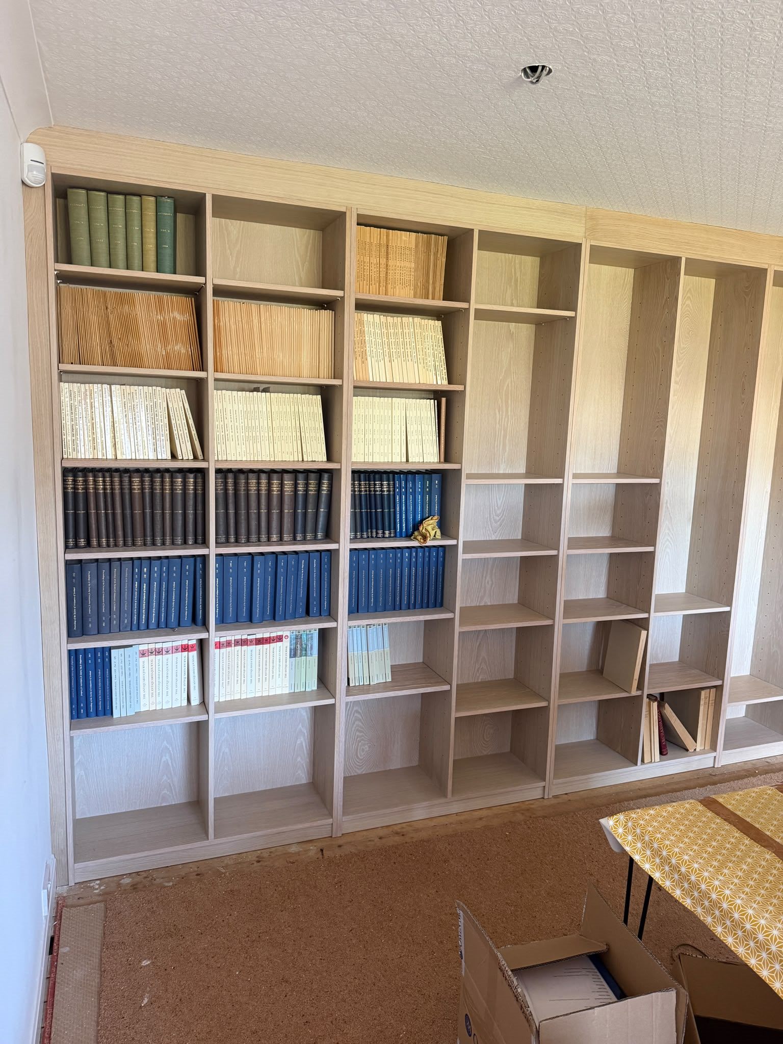 Wall-to-wall fitted home library designed and made by MRB Joinery